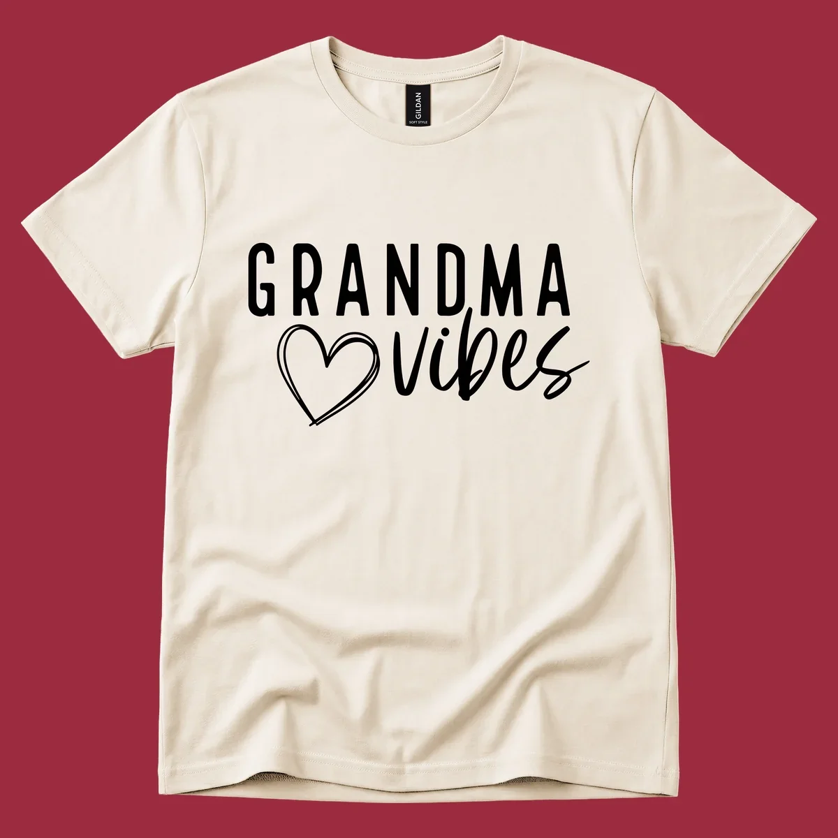 Grandma vibes text with a heart outline, white on black and black on white.