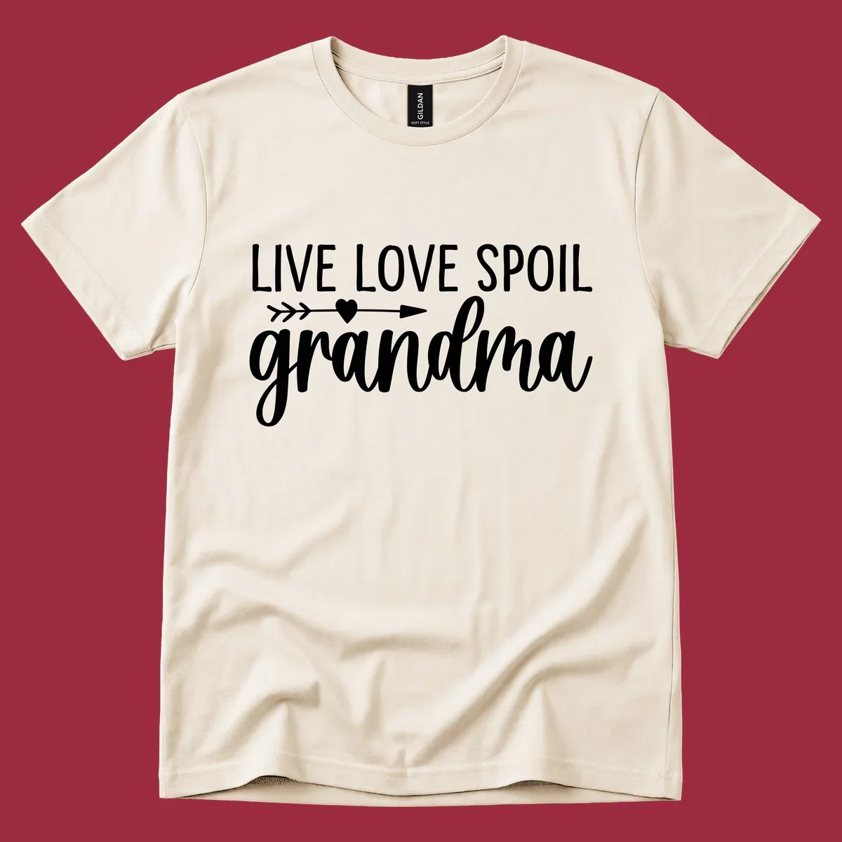 Live Love Spoil Grandma typography design with heart and arrow.