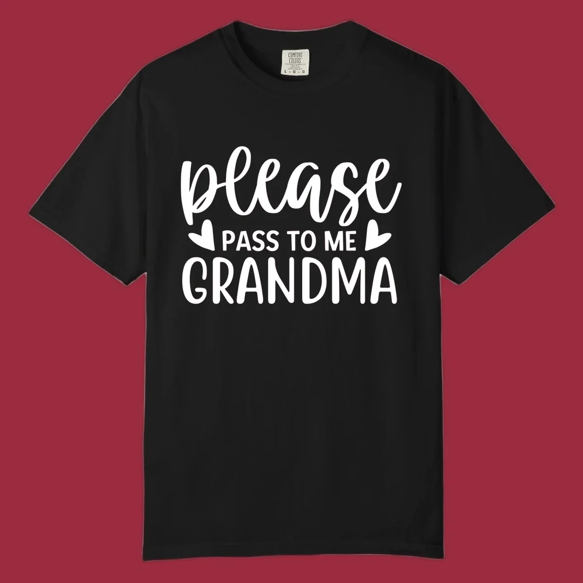 Grandma please pass me the snacks text design with heart accents.