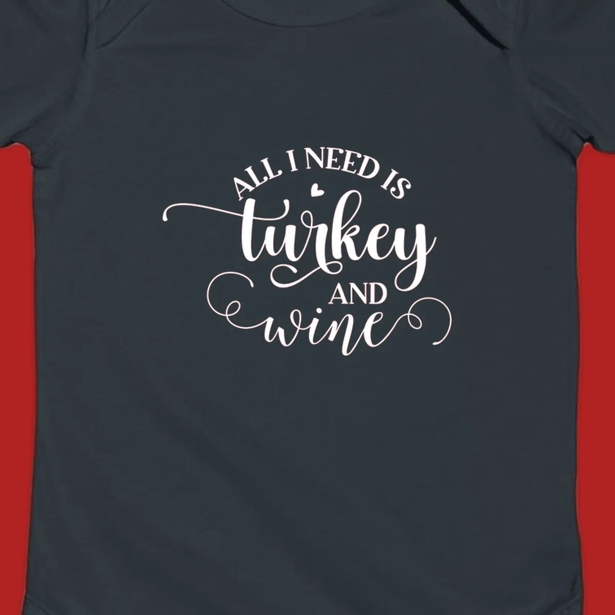 Typography design with text All I Need Is Turkey And Wine, featuring a small heart.