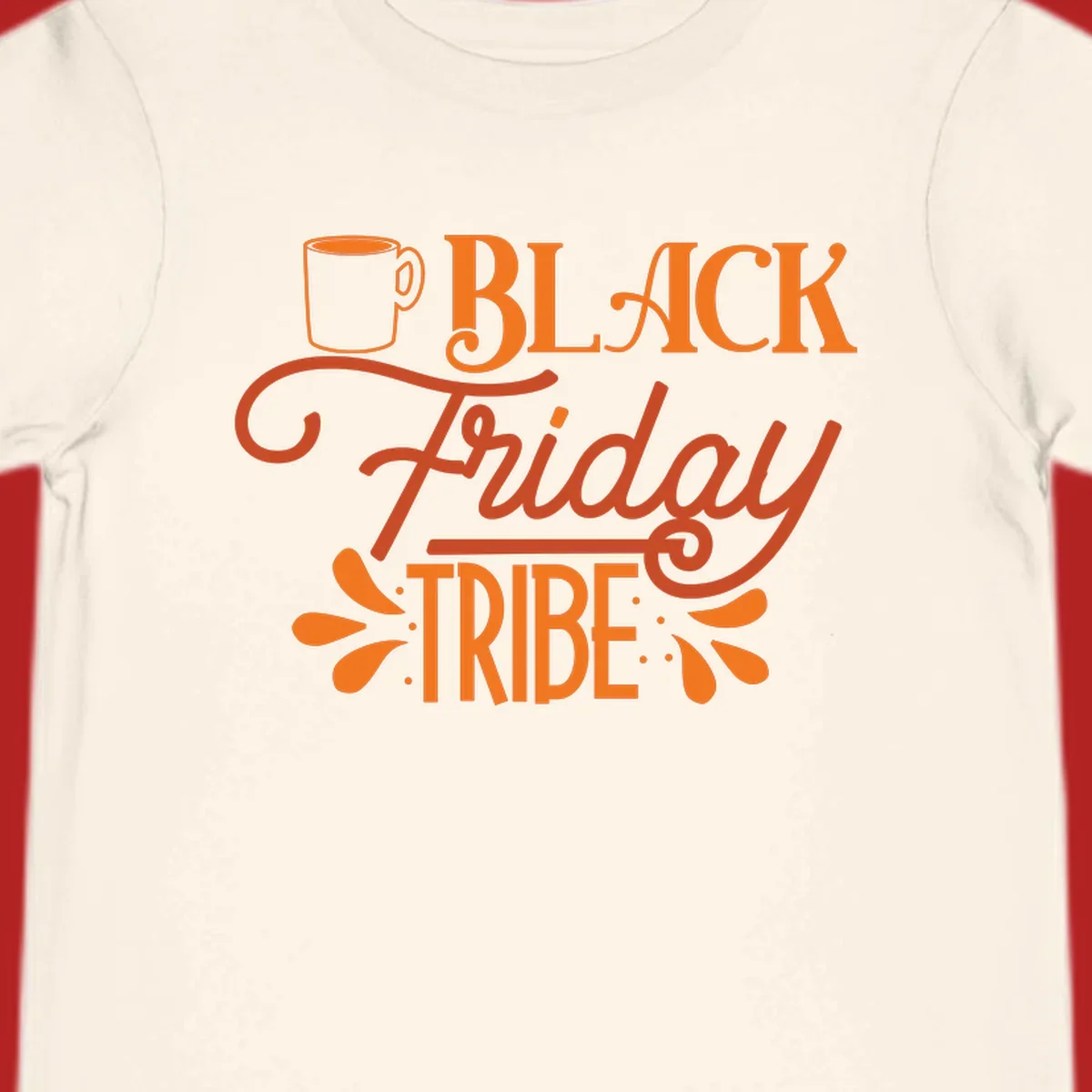 Black Friday Tribe text and coffee mug design, orange and white on black and white backgrounds.