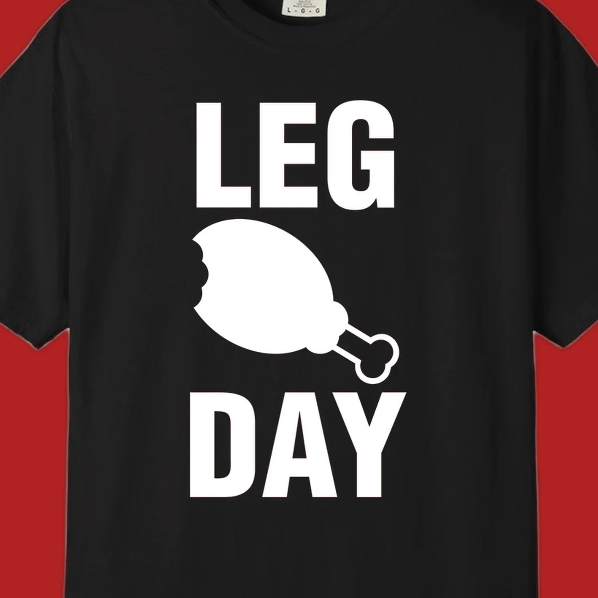 Bold text LEG DAY with a bitten chicken leg graphic in between.