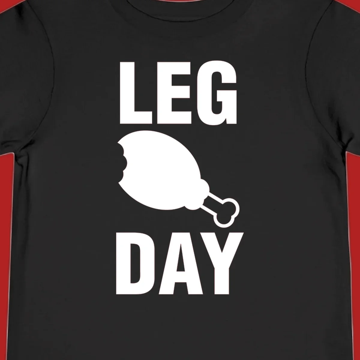 Bold text LEG DAY with a bitten chicken leg graphic in between.