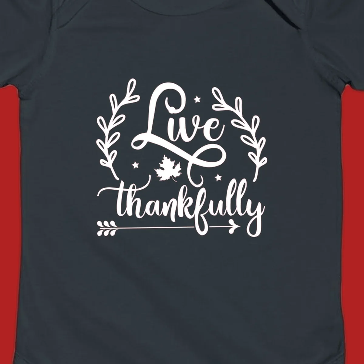 Live thankfully fall design with script text, leaves, and stars.