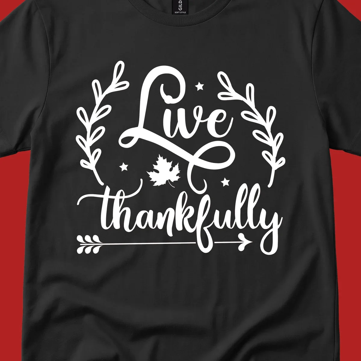 Live thankfully fall design with script text, leaves, and stars.