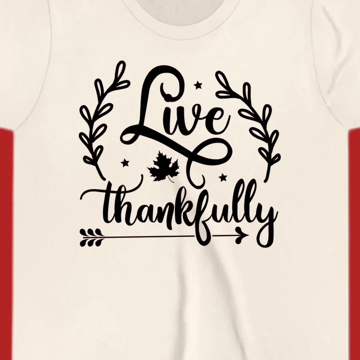 Live thankfully fall design with script text, leaves, and stars.