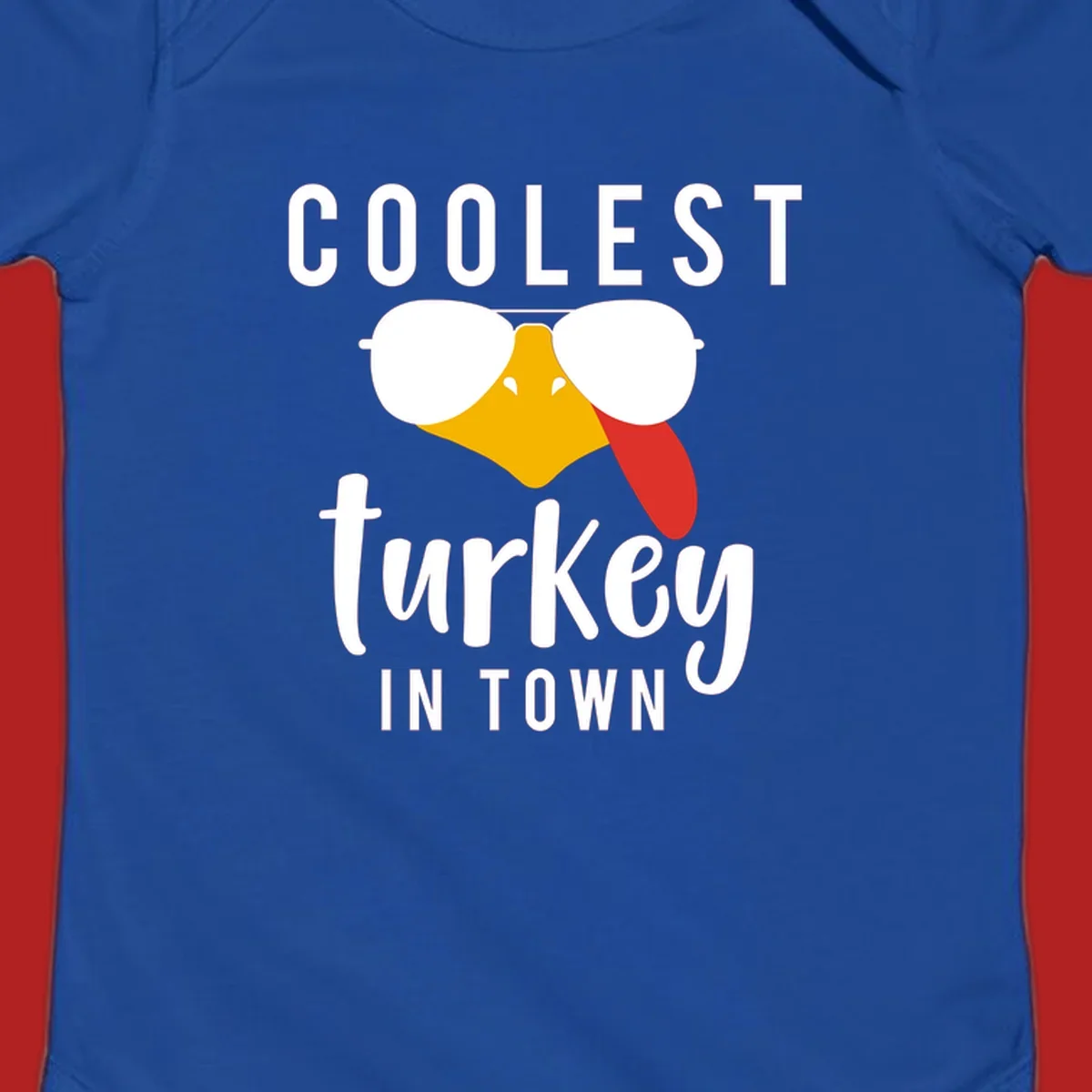 Coolest Turkey In Town Thanksgiving design with a cartoon turkey wearing sunglasses and sticking its tongue out.