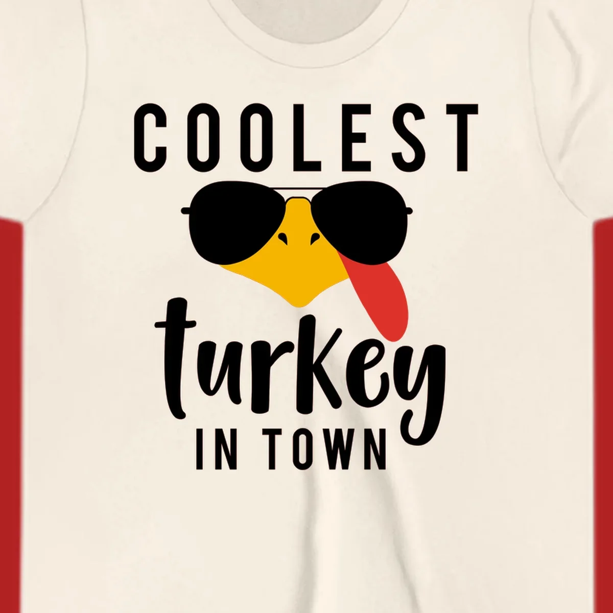 Coolest Turkey In Town Thanksgiving design with a cartoon turkey wearing sunglasses and sticking its tongue out.