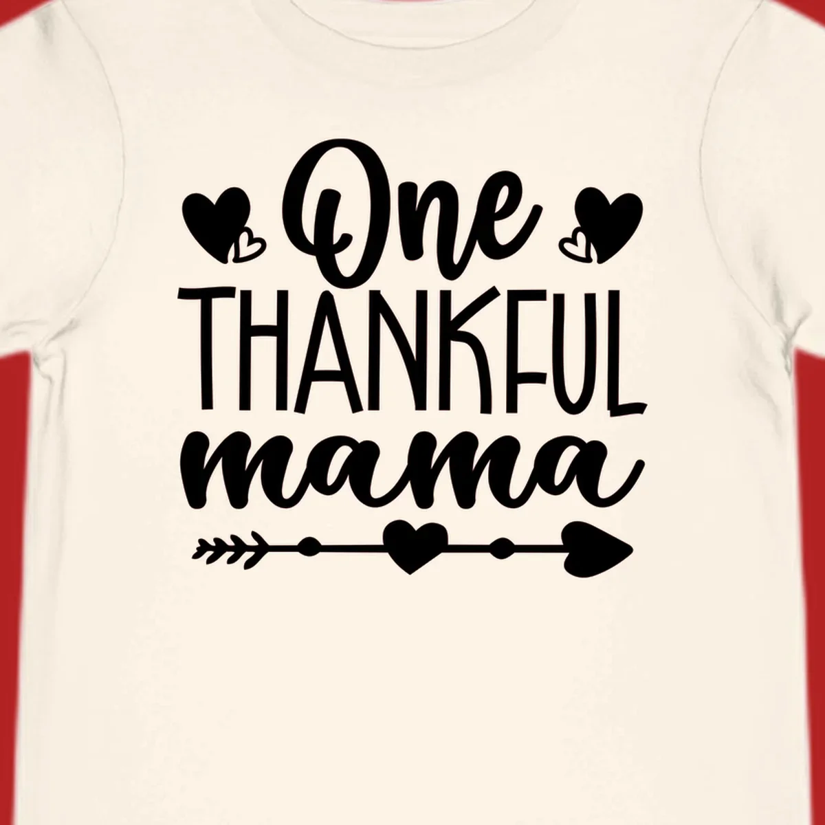 Typography design with hearts and an arrow that says "One THANKFUL mama".