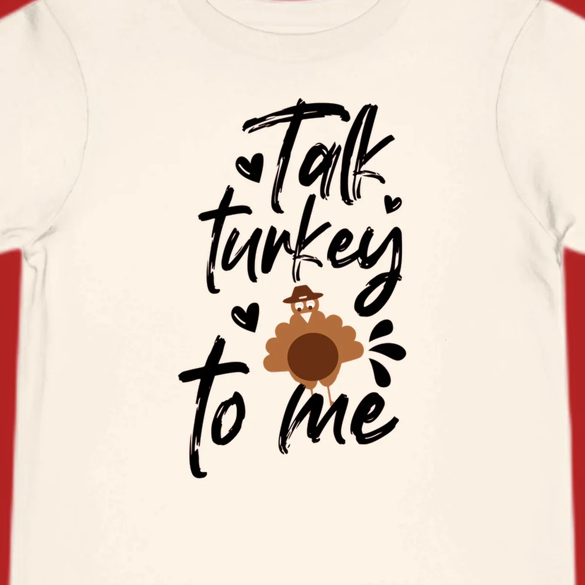 Talk turkey to me Thanksgiving graphic with a cute turkey and hearts.