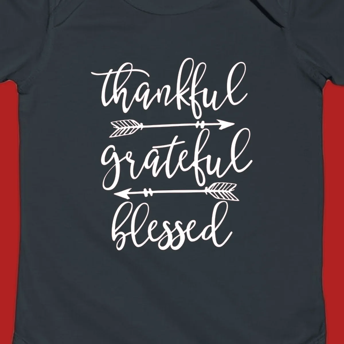 Thankful grateful blessed typography design with arrows on black and white backgrounds.