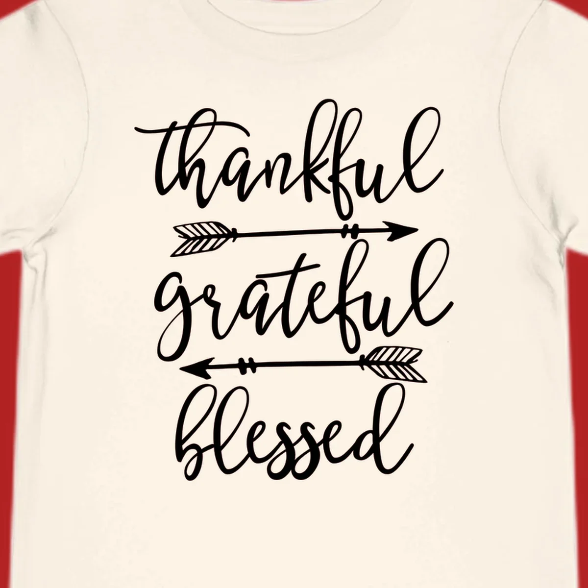 Thankful grateful blessed typography design with arrows on black and white backgrounds.