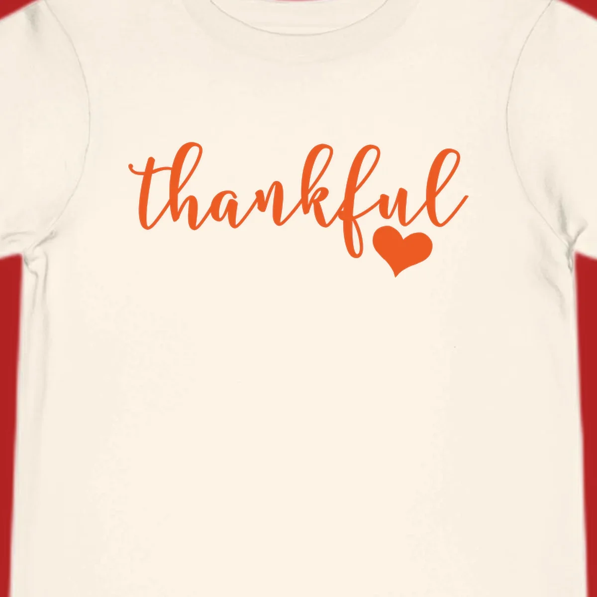 Orange script text 'thankful' with a heart accent, thankful-heart-script.