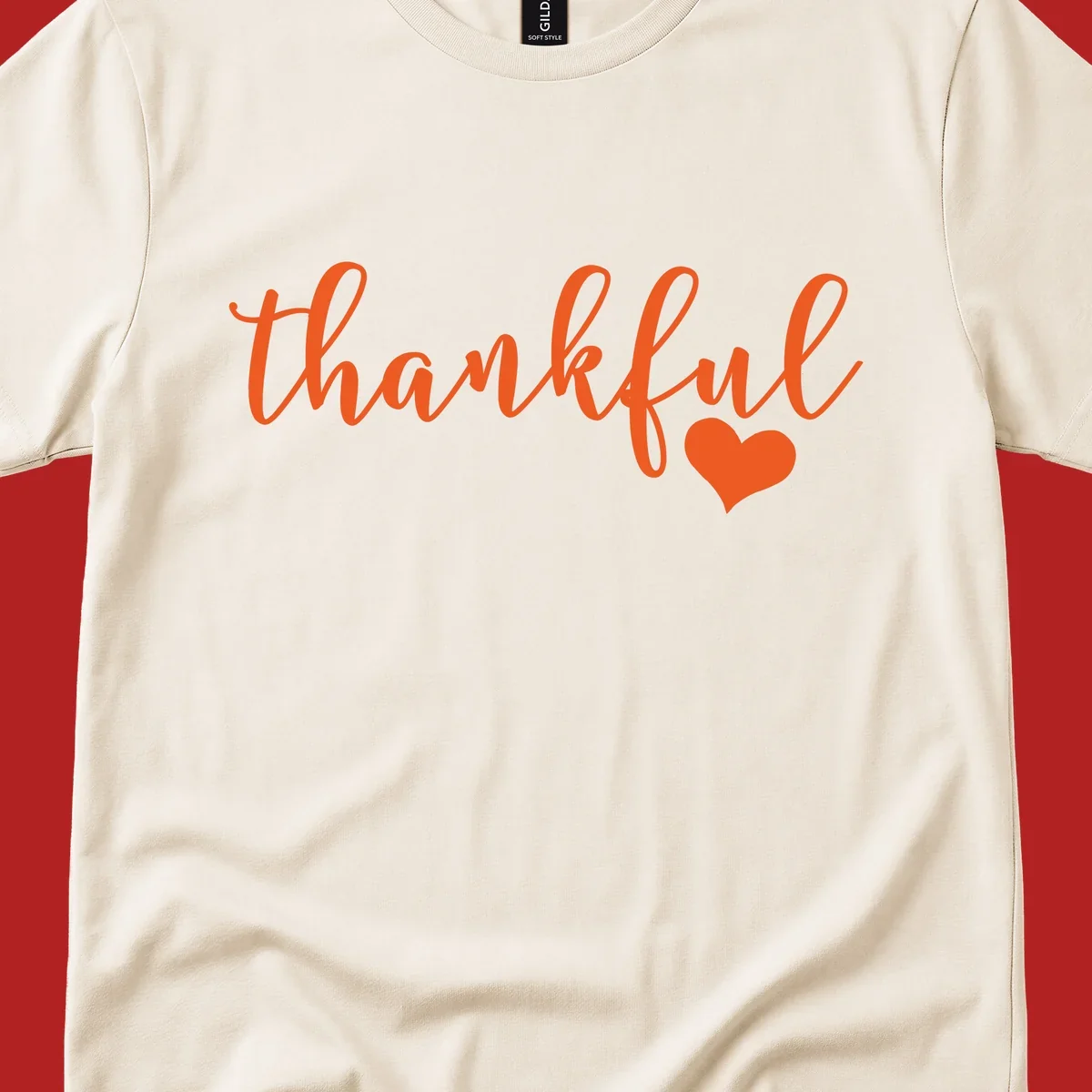 Orange script text 'thankful' with a heart accent, thankful-heart-script.