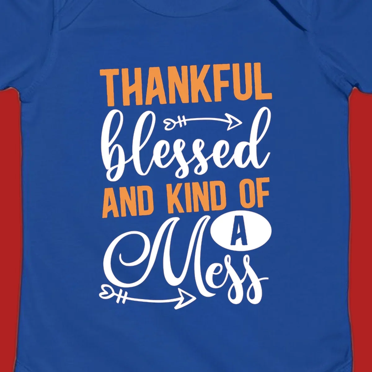 Thankful Blessed And Kind Of A Mess typography design with orange and white text on black background.