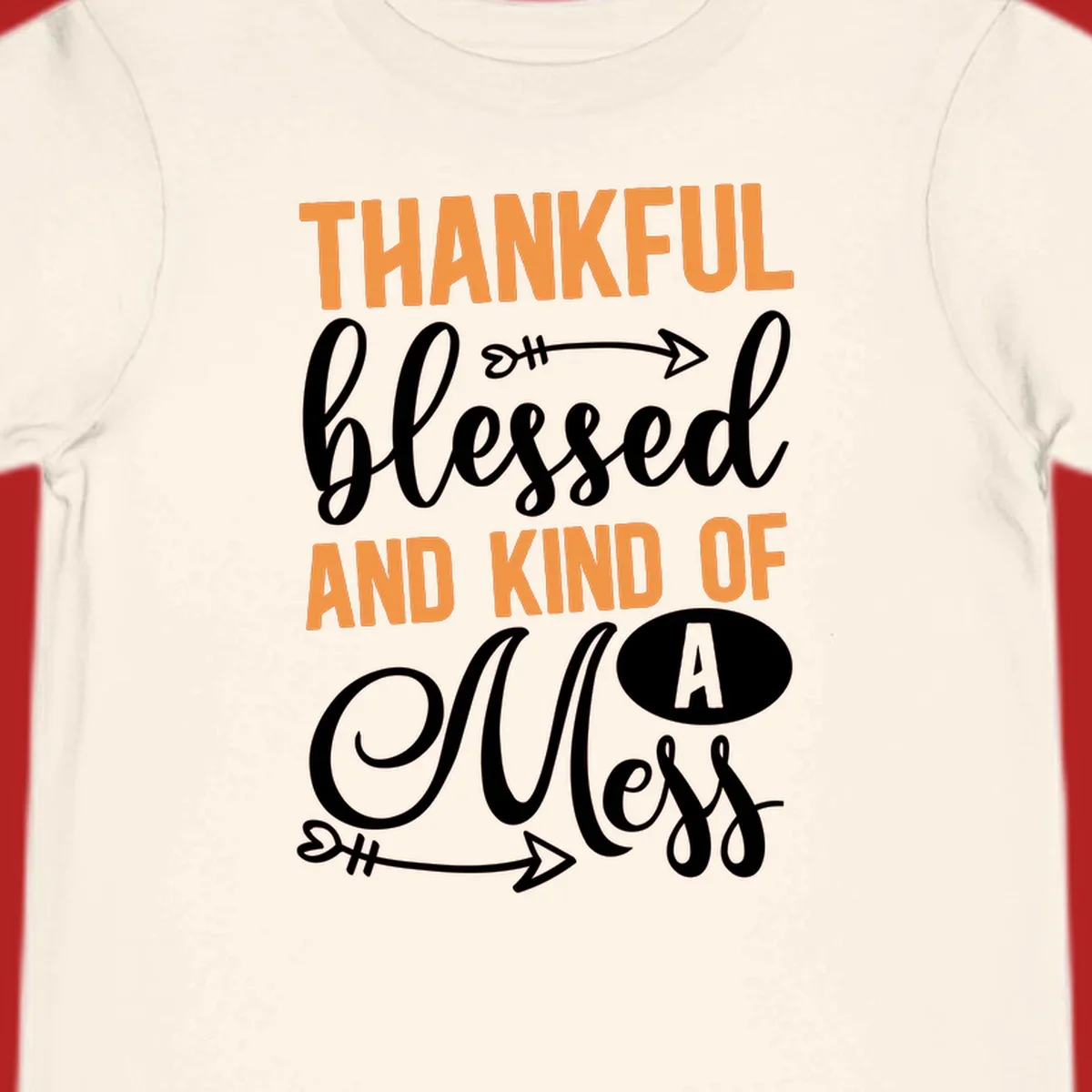 Thankful Blessed And Kind Of A Mess typography design with orange and white text on black background.