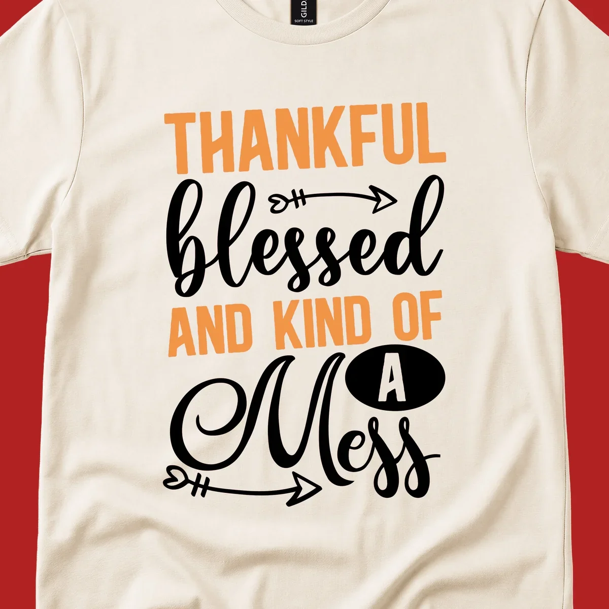 Thankful Blessed And Kind Of A Mess typography design with orange and white text on black background.