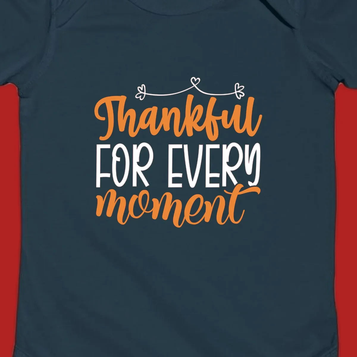 Thankful for every moment text design with orange and white lettering on black background.