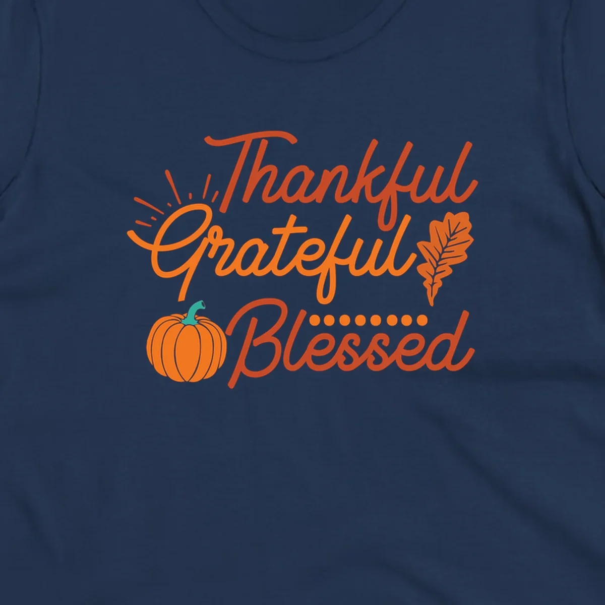 Thankful Grateful Blessed Thanksgiving design with pumpkin and oak leaf.