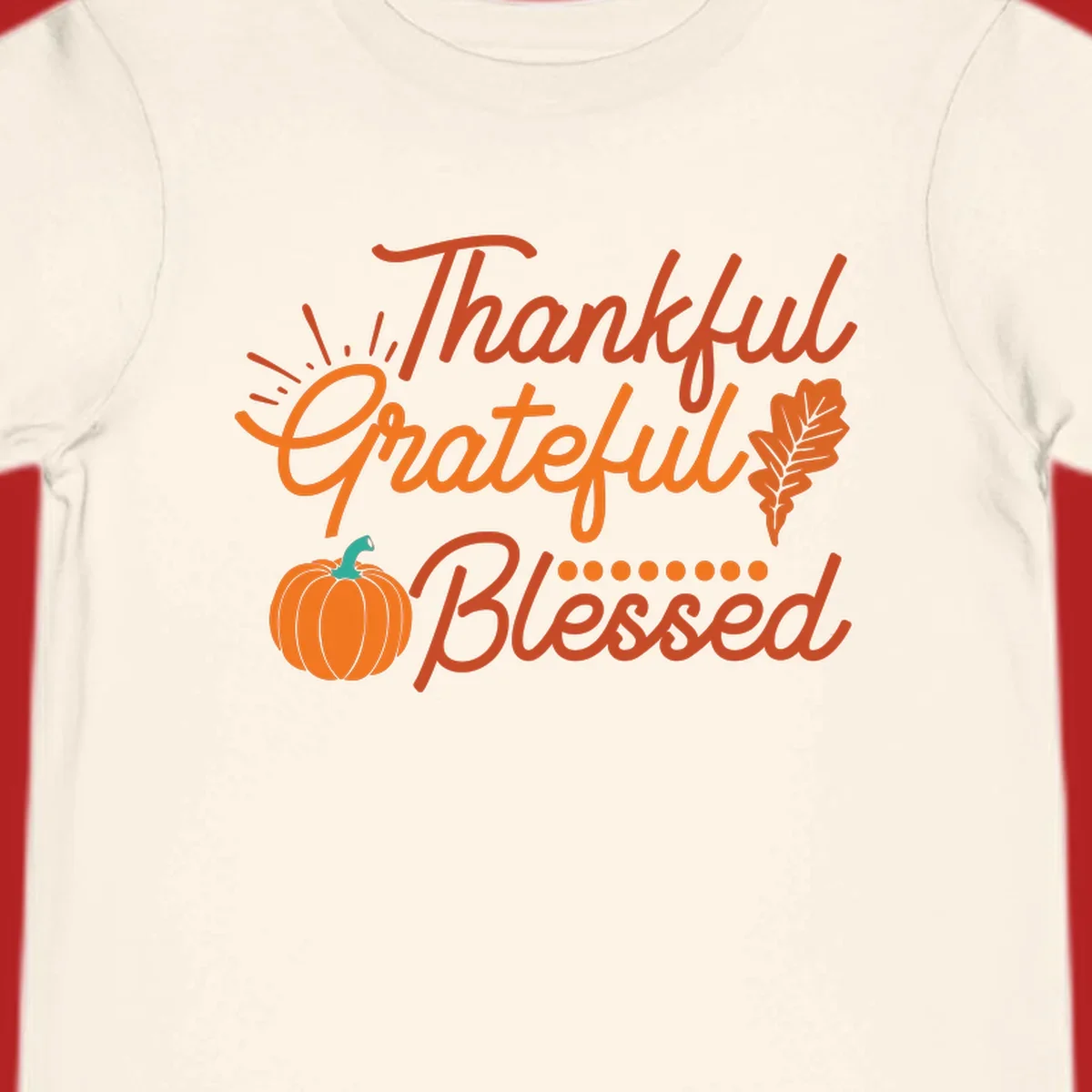 Thankful Grateful Blessed Thanksgiving design with pumpkin and oak leaf.