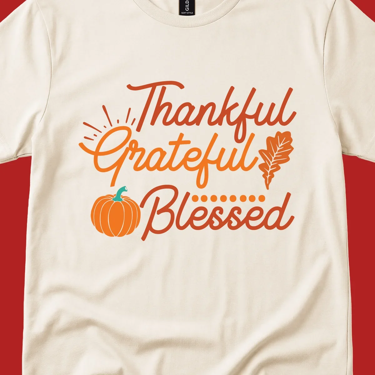 Thankful Grateful Blessed Thanksgiving design with pumpkin and oak leaf.