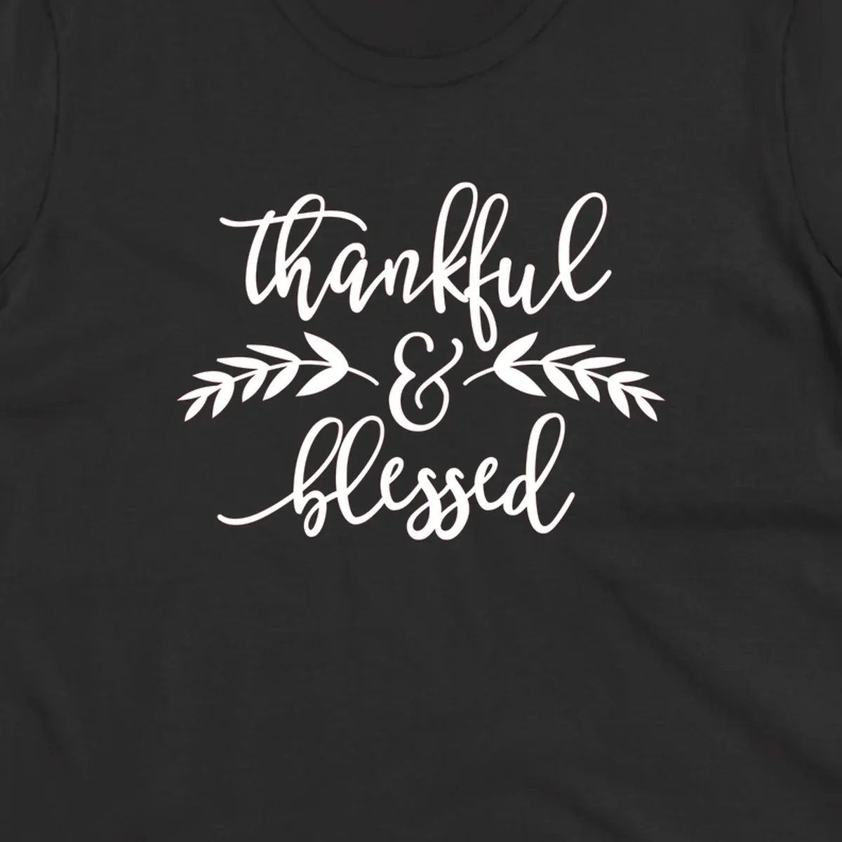 Thankful and Blessed script text with decorative leaves.