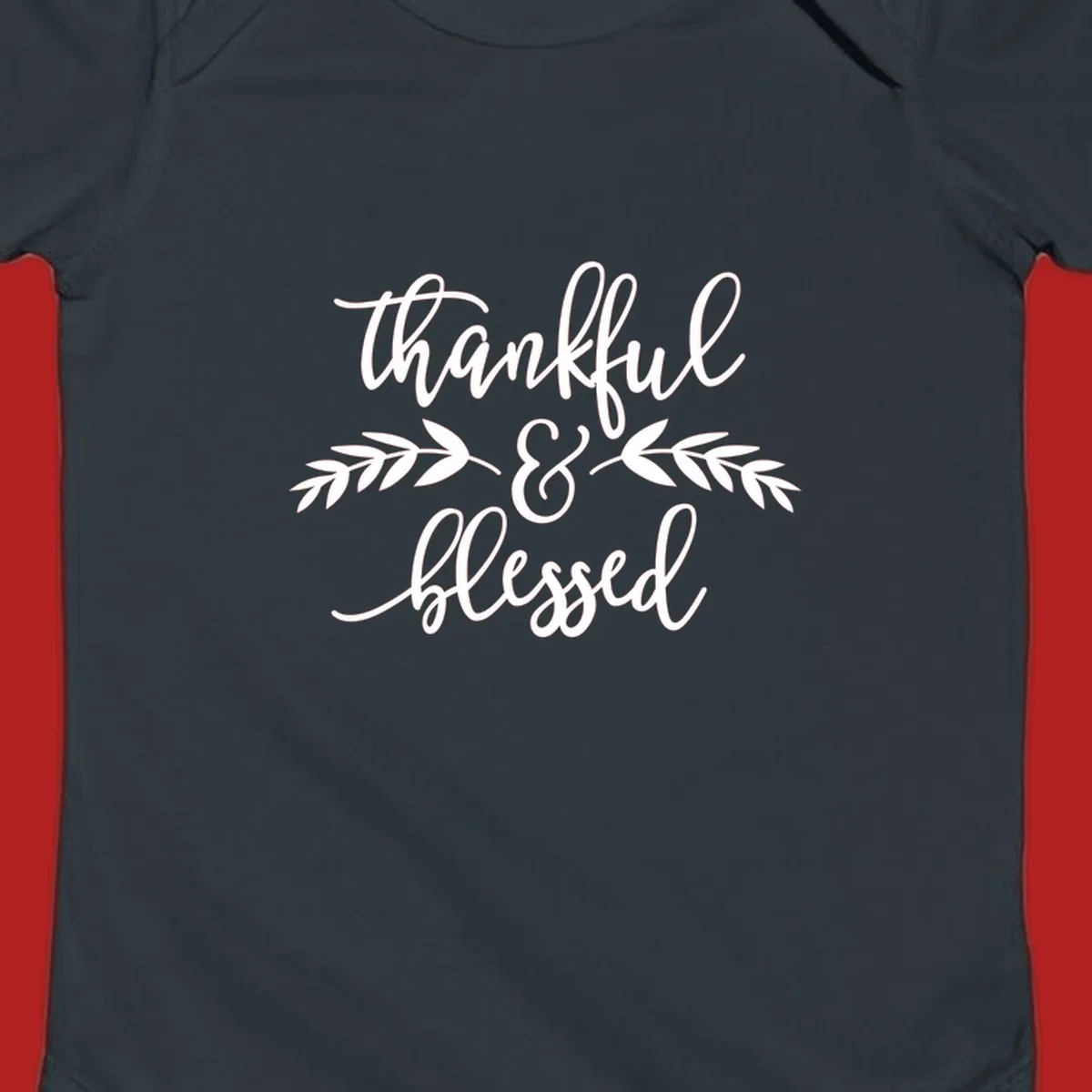 Thankful and Blessed script text with decorative leaves.
