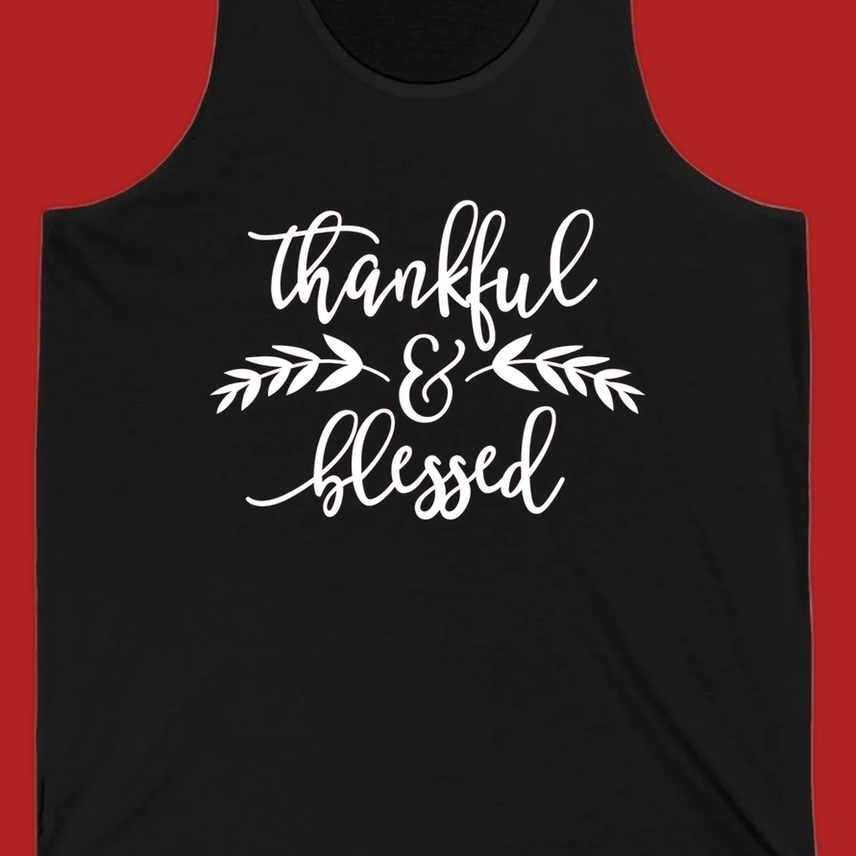 Thankful and Blessed script text with decorative leaves.