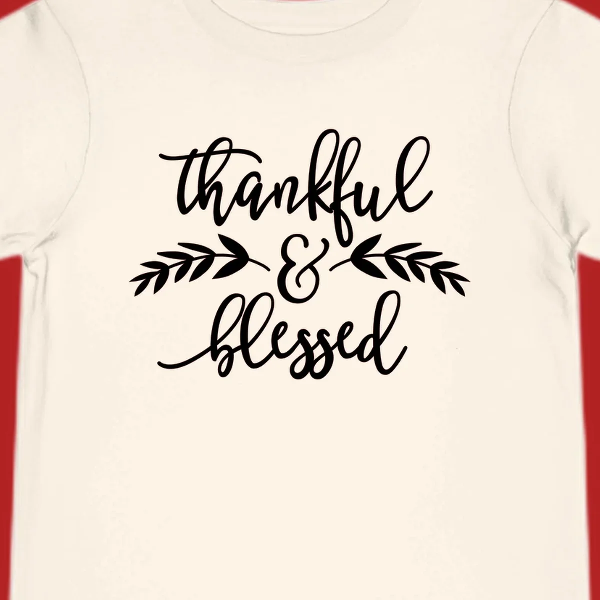 Thankful and Blessed script text with decorative leaves.