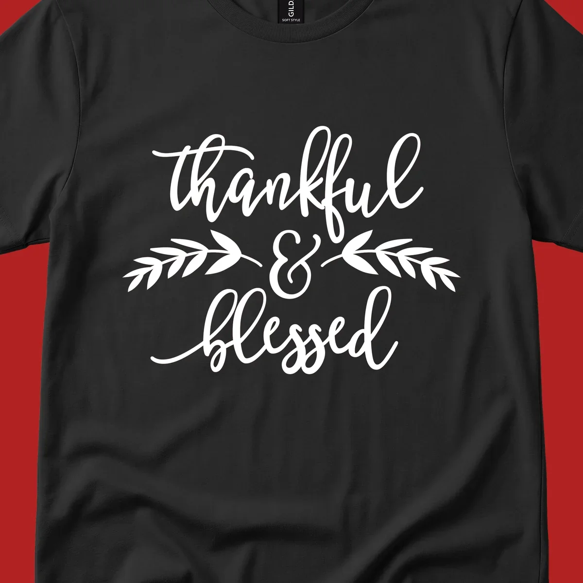Thankful and Blessed script text with decorative leaves.