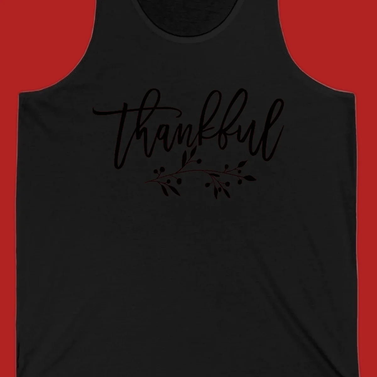 Elegant script text 'Thankful' with a small botanical branch accent, on a plain background.