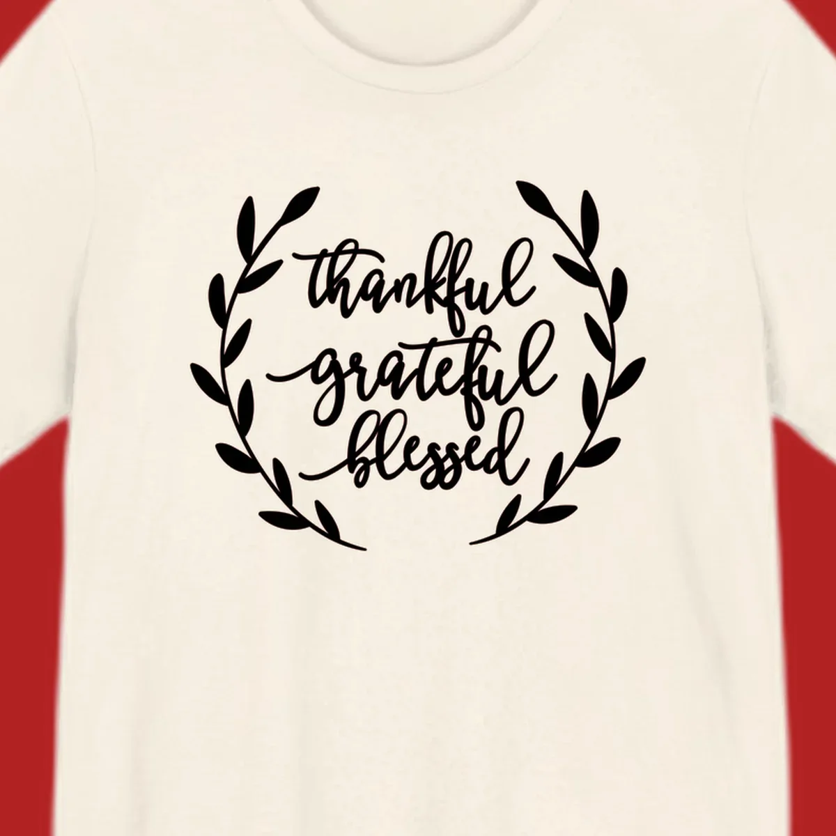 Thankful grateful blessed text inside a wreath graphic.