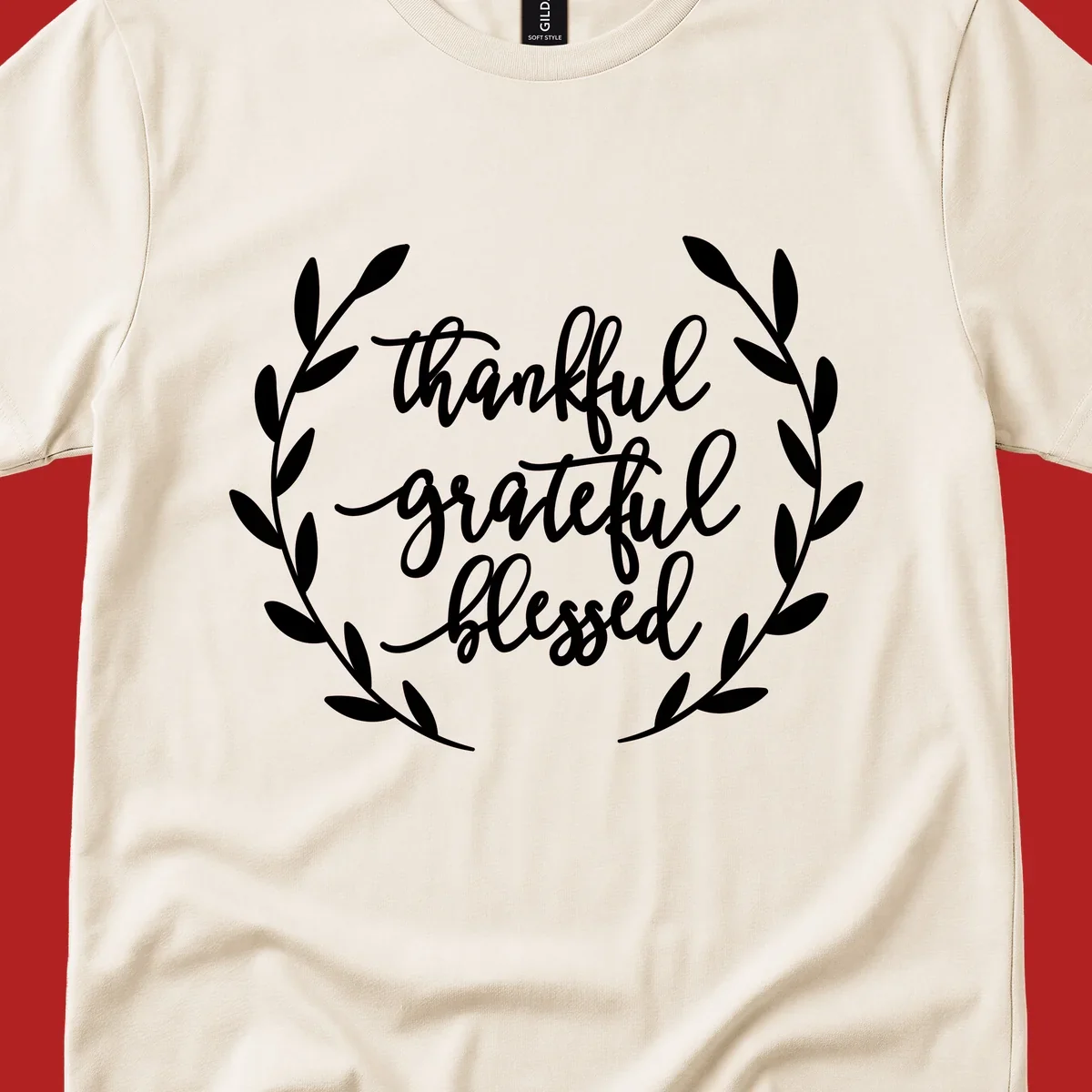 Thankful grateful blessed text inside a wreath graphic.