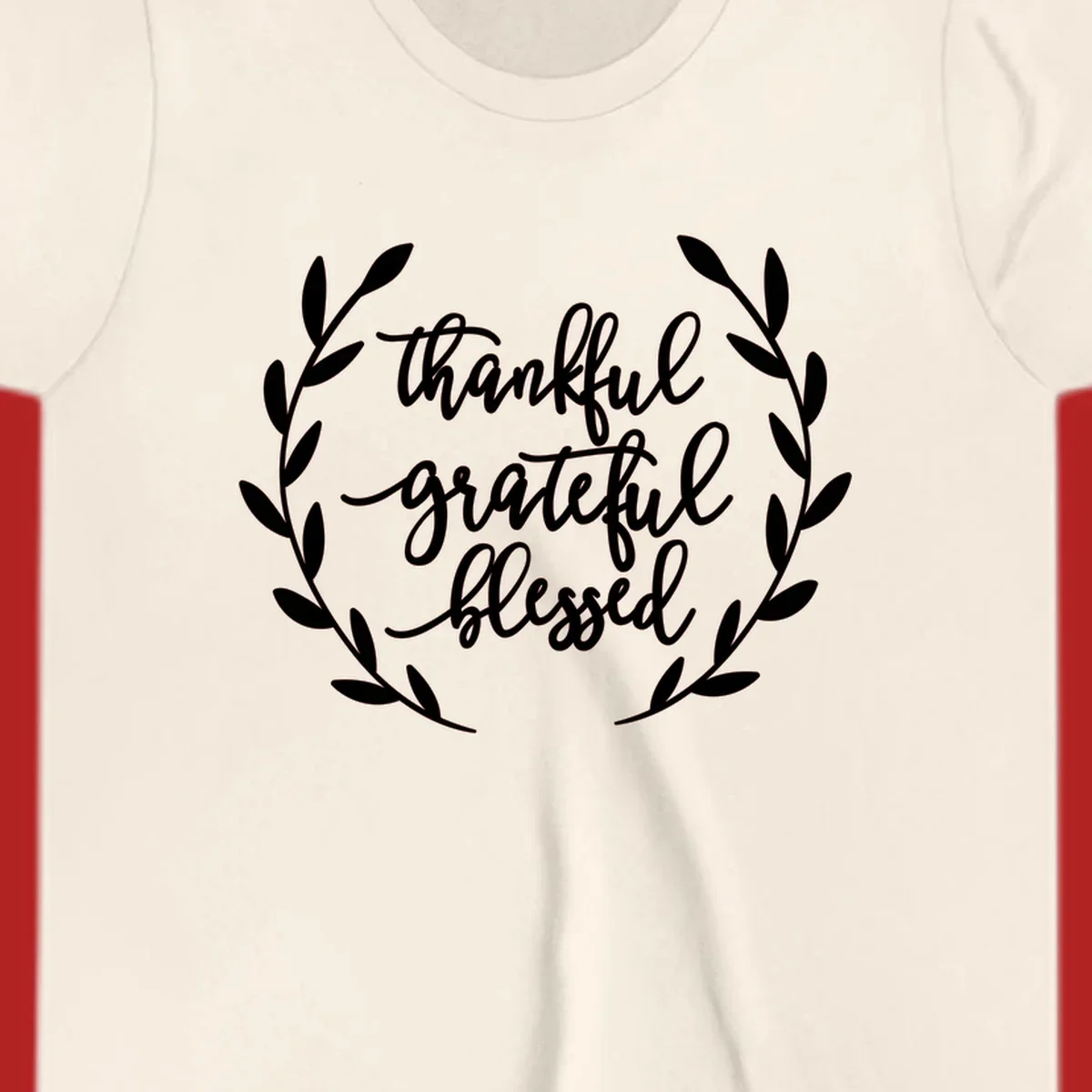 Thankful grateful blessed text inside a wreath graphic.