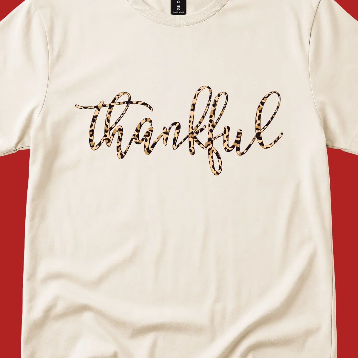 Thankful text in leopard print with a white outline.