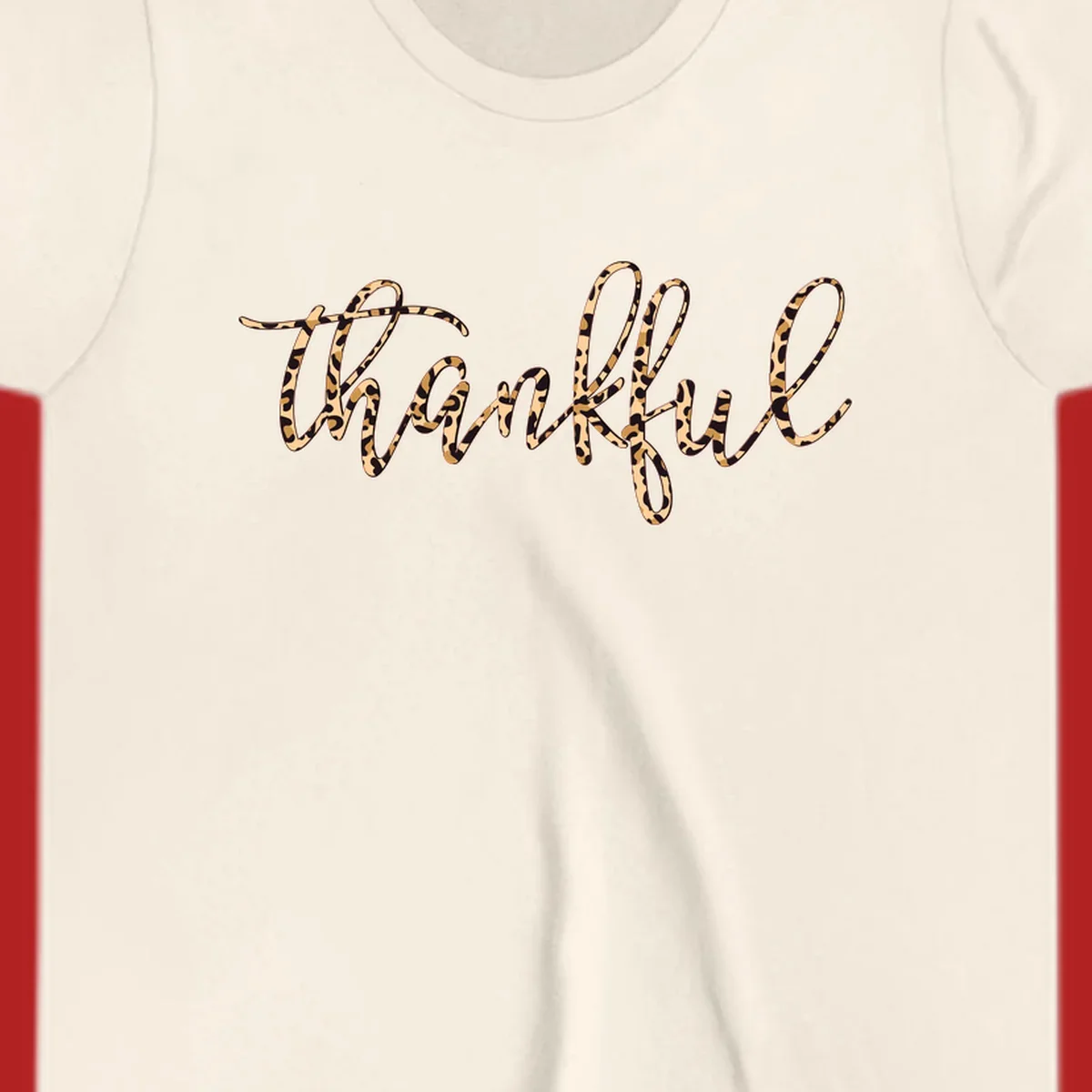Thankful text in leopard print with a white outline.