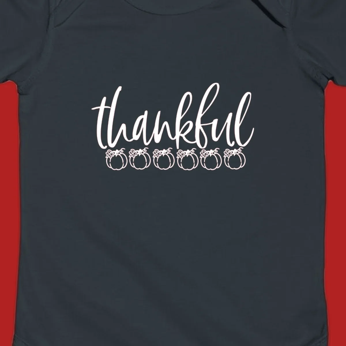 White script text 'thankful' above six white pumpkin illustrations, thankful pumpkins thanksgiving