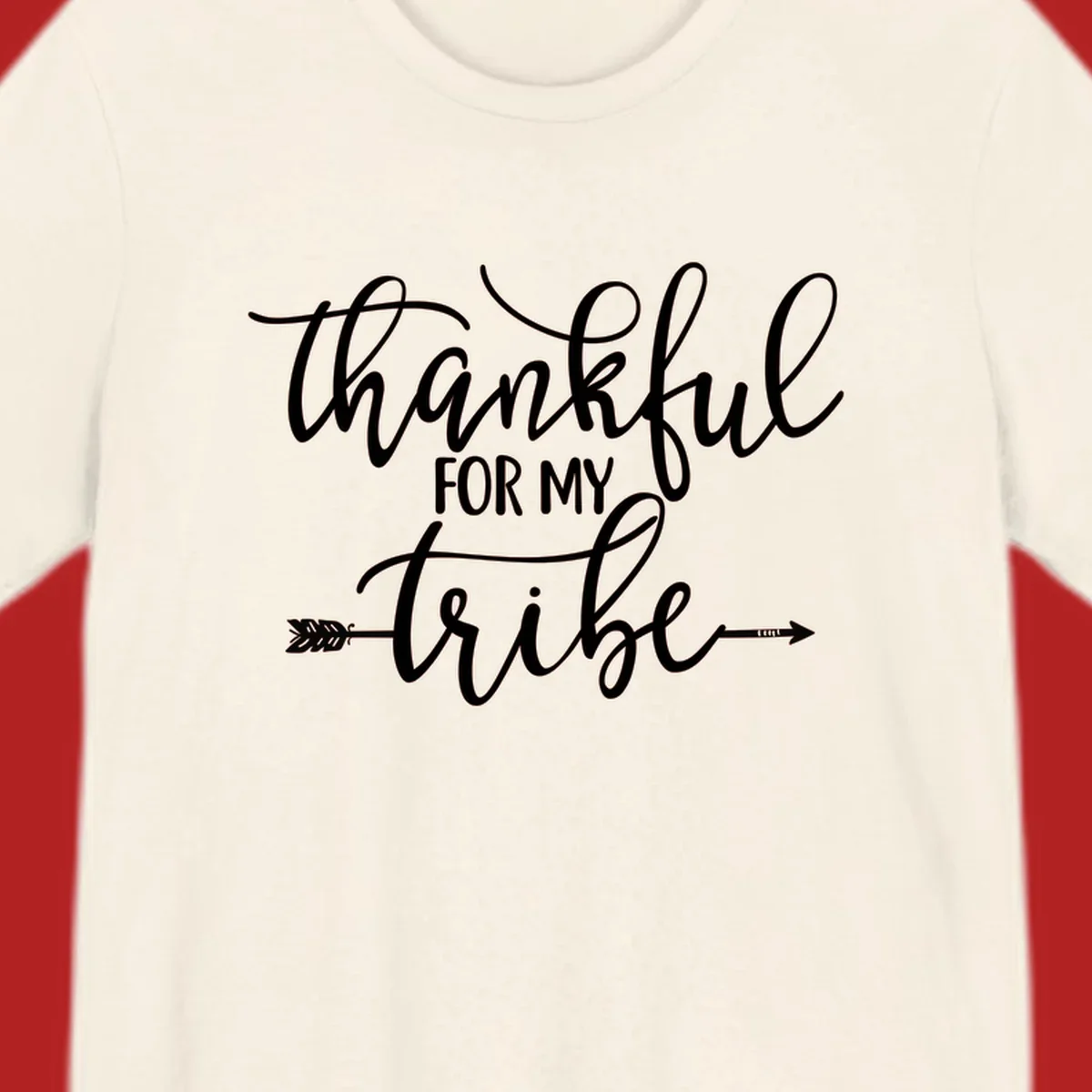 Thankful for my tribe typography design with arrow graphic on black background.