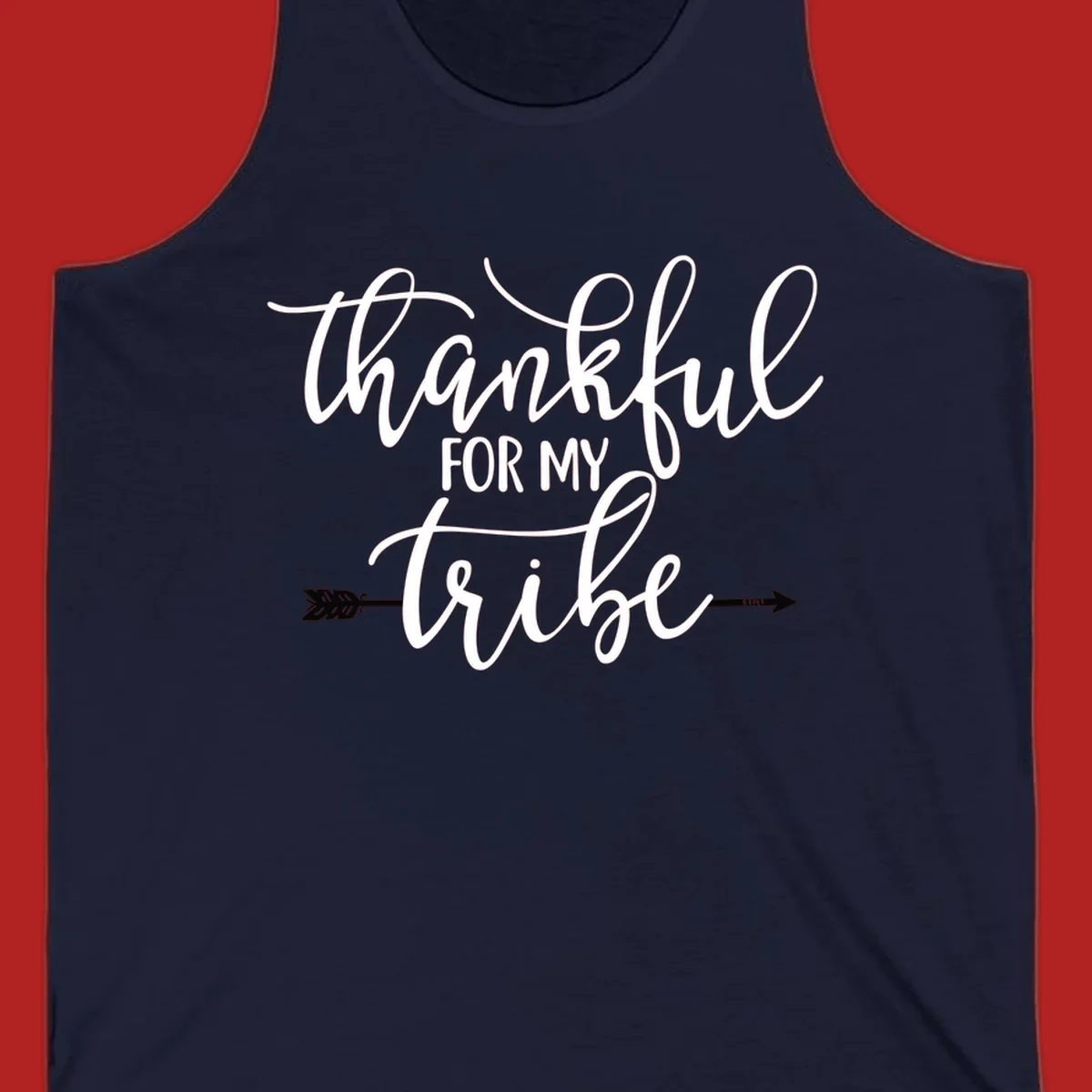 Thankful for my tribe typography design with arrow graphic on black background.