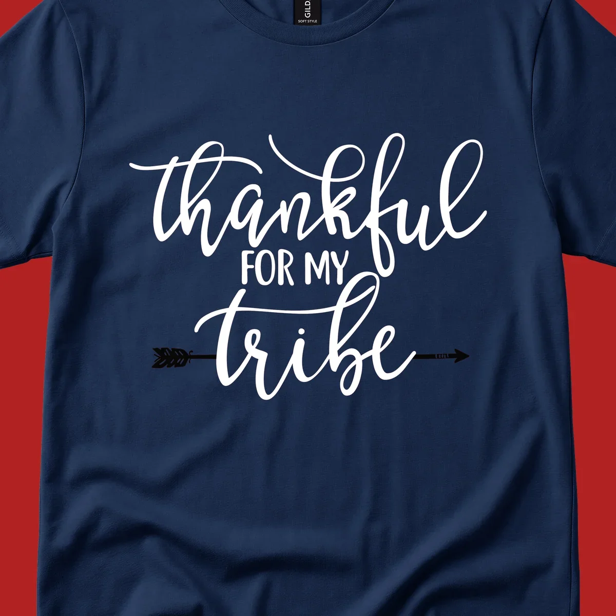 Thankful for my tribe typography design with arrow graphic on black background.