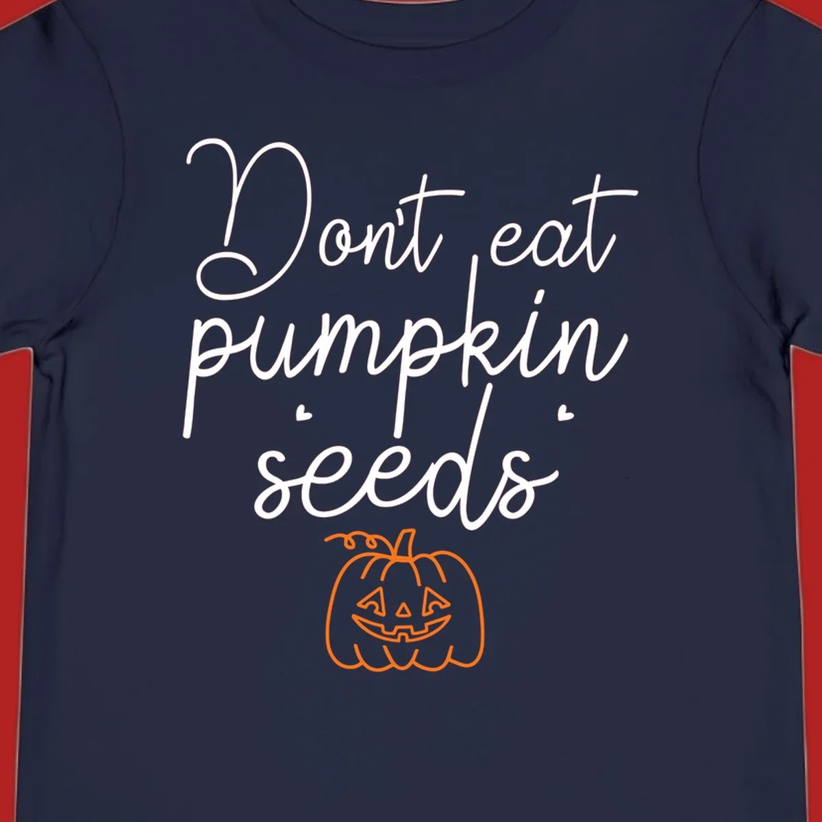Don't eat pumpkin seeds Halloween text with jack-o-lantern illustration