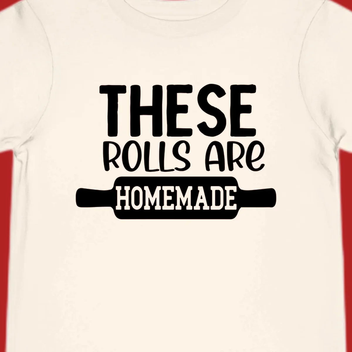 White text 'THESE ROLLS ARE HOMEMADE' with a rolling pin illustration, for homemade rolls baking concept.