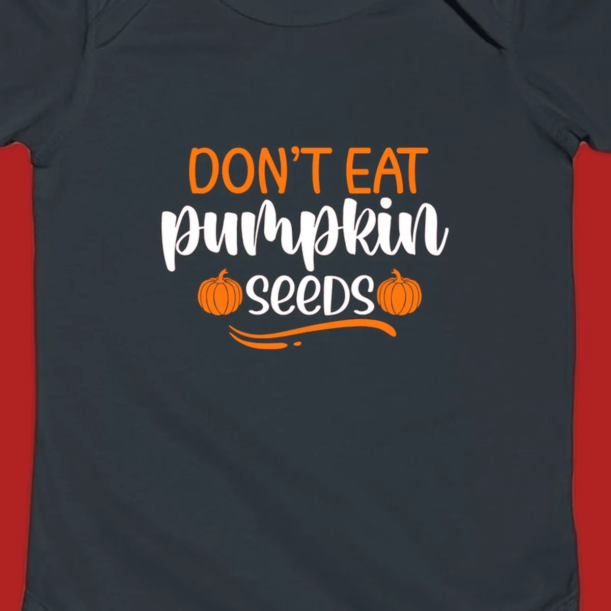 Don't Eat Pumpkin Seeds Fall Saying with pumpkins and swirls