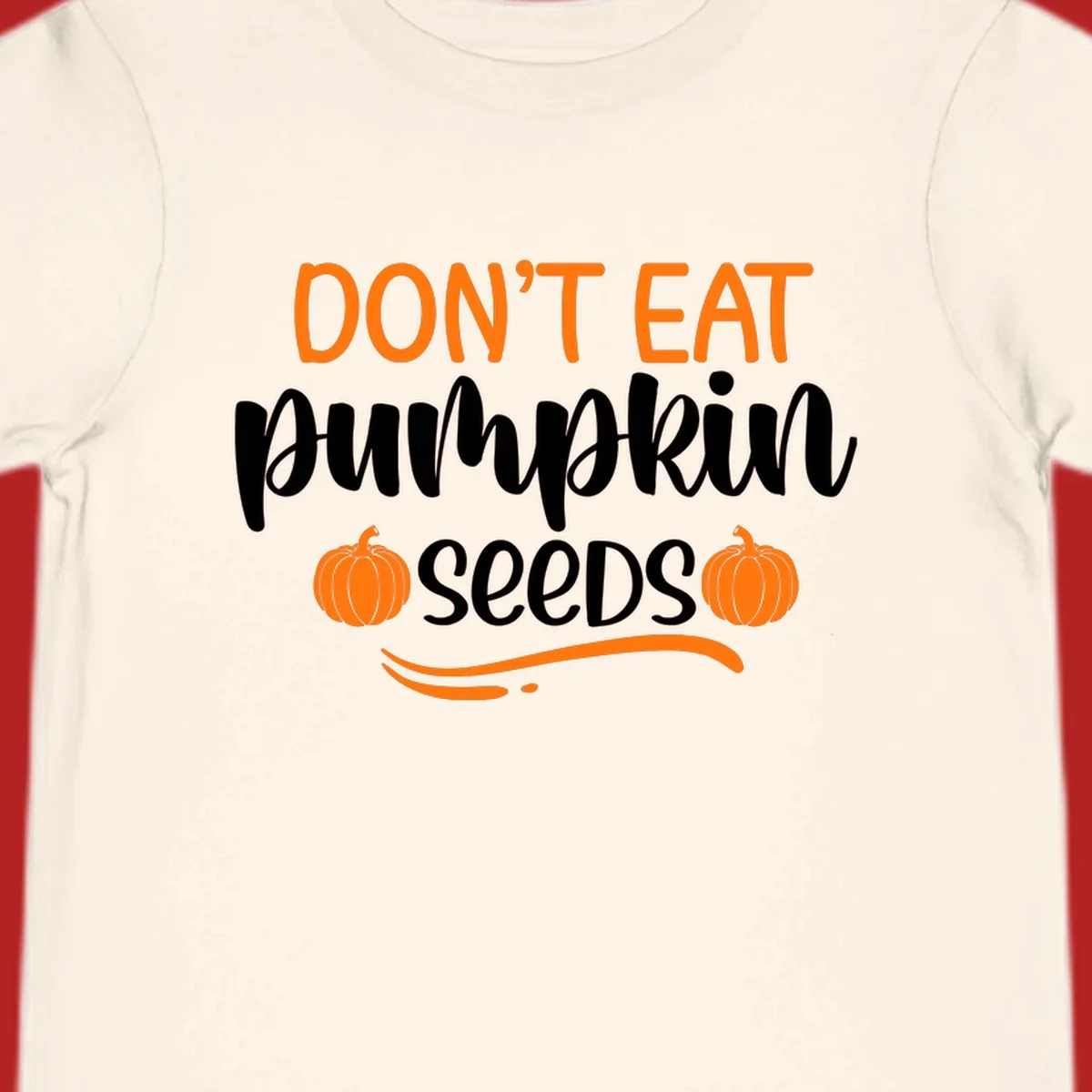 Don't Eat Pumpkin Seeds Fall Saying with pumpkins and swirls