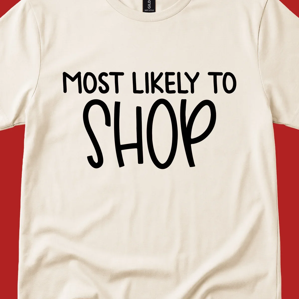 White text that says MOST LIKELY TO SHOP on a black background. Design for shop til you drop.