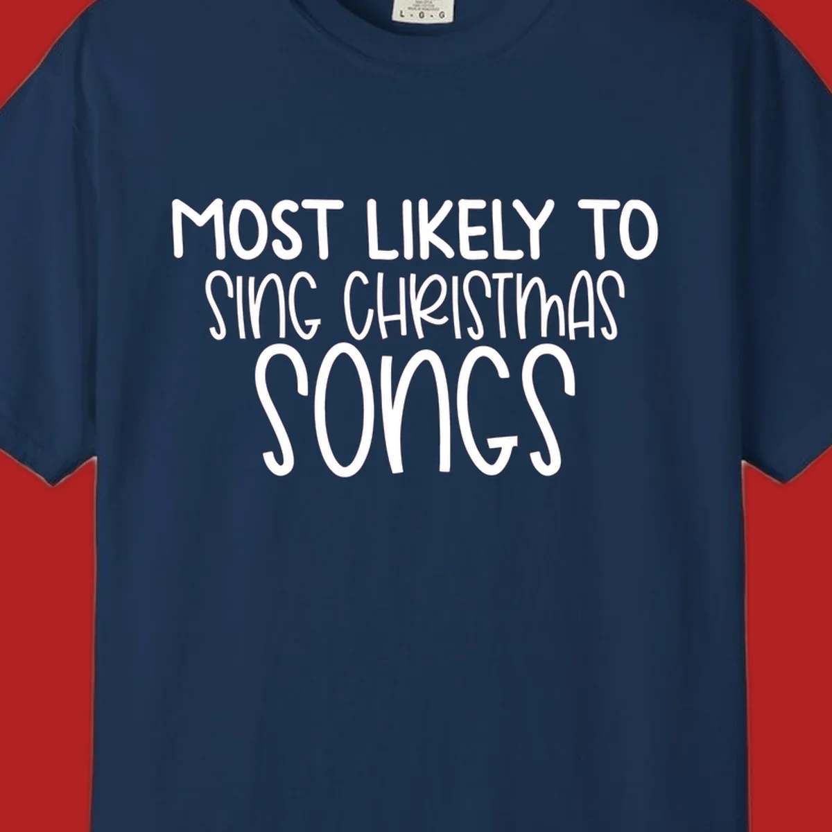 Text design 'Most Likely To Sing Christmas Songs' in white, bold lettering.