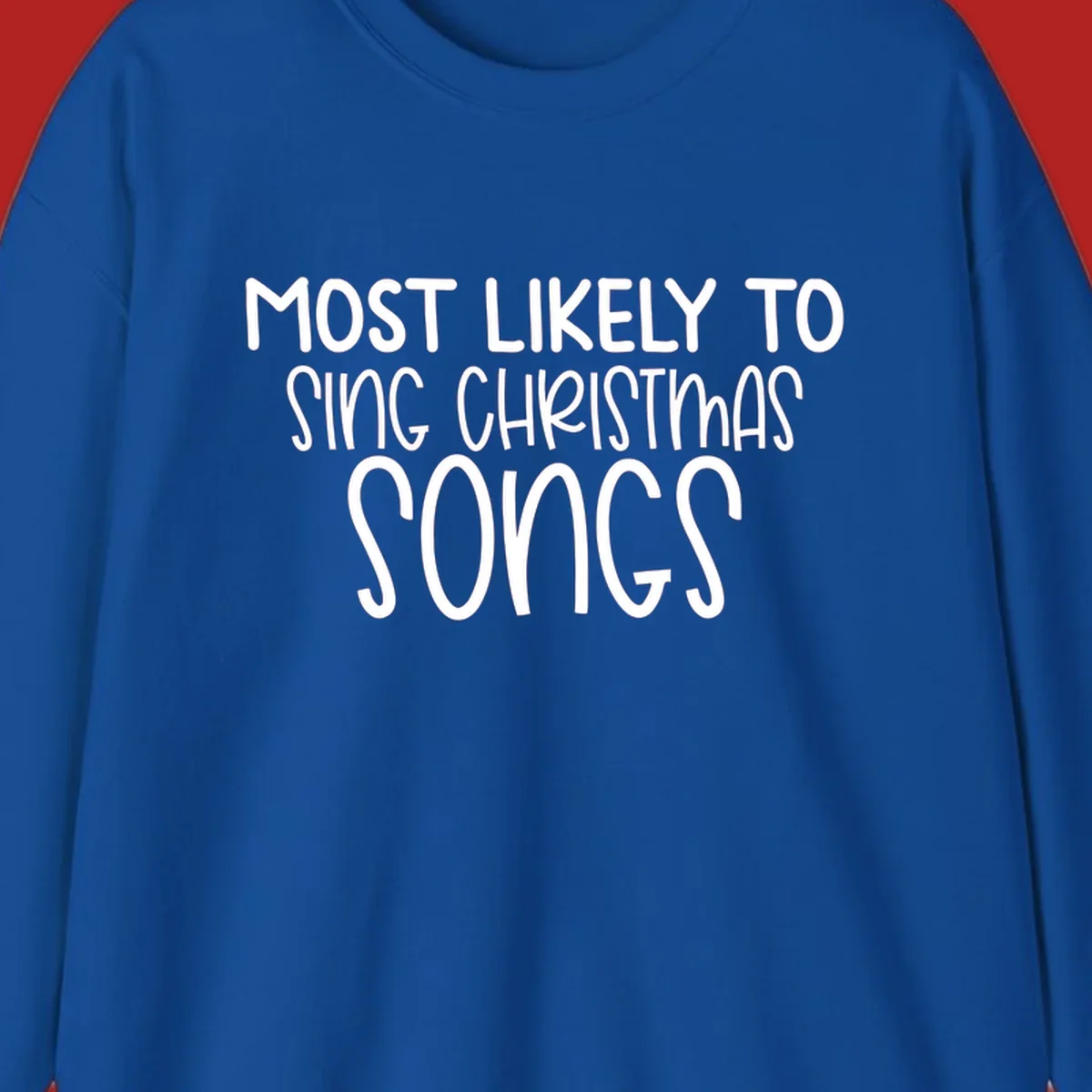 Text design 'Most Likely To Sing Christmas Songs' in white, bold lettering.