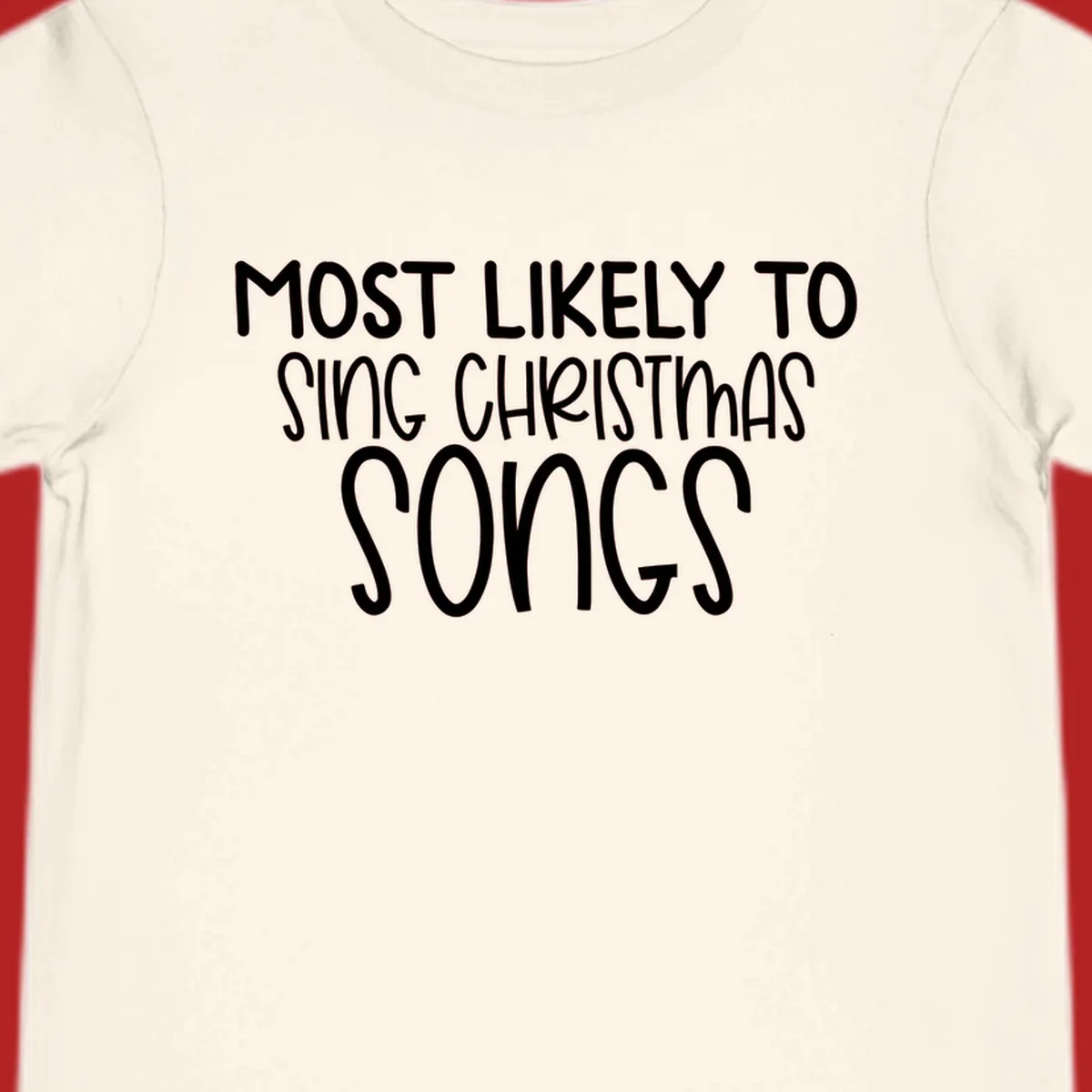 Text design 'Most Likely To Sing Christmas Songs' in white, bold lettering.