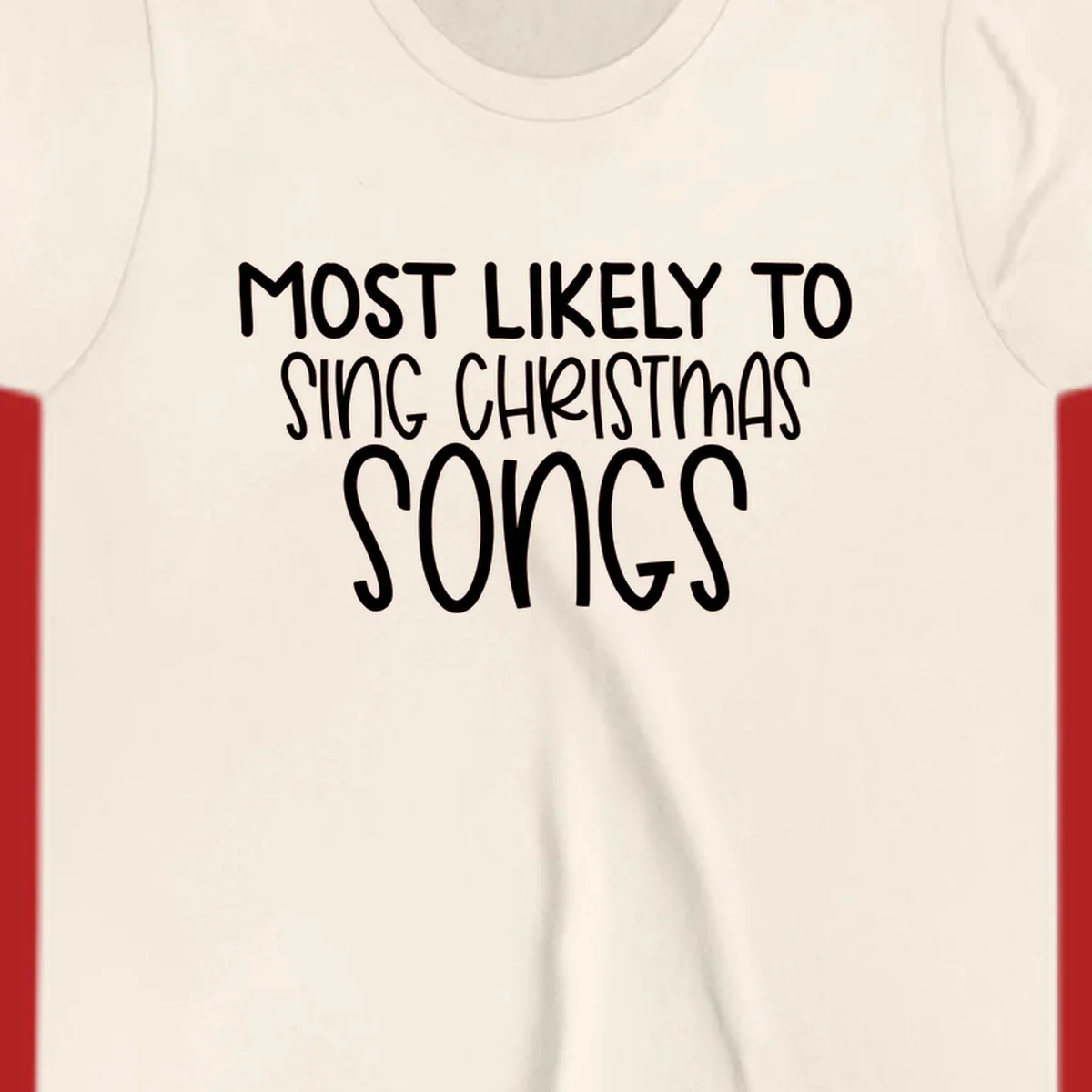 Text design 'Most Likely To Sing Christmas Songs' in white, bold lettering.