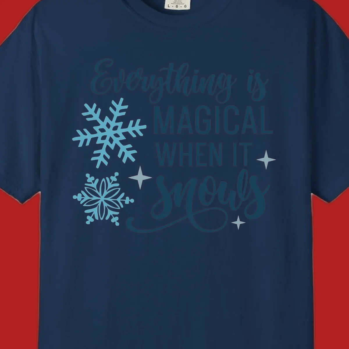 Everything is Magical When It Snows typography with snowflakes and stars.